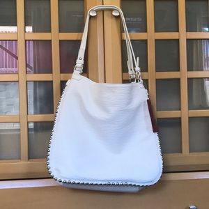 Carlos Santana purse